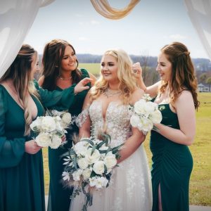 Bridesmaid and bride with custom bridal bouquet and bridesmaid bouquets near Hickory, NC.